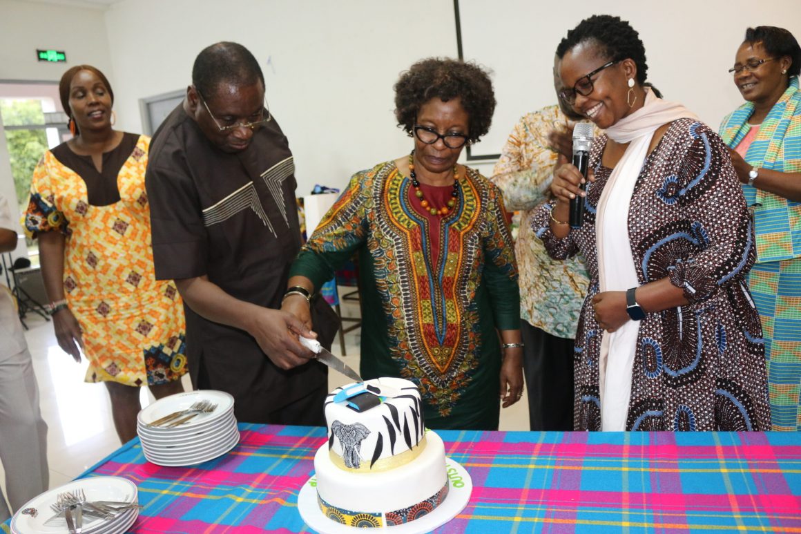 Prof.-Elegwa-Mukulu-is-assisted-to-cut-a-cake-by-his-wife-during-his-Farewell-ceremony.-Looking-on-is-scaled Prof. Mukulu: Three Decades of Illustrious Service to JKUAT